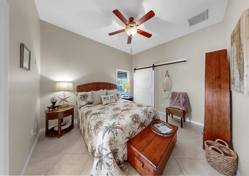 914 Capriccio Lane Apollo Beach, FL 33572 - Photo 46 of 75 a bedroom with a bed and window