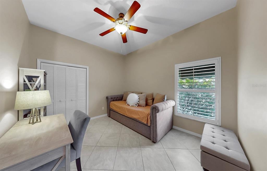 914 Capriccio Lane Apollo Beach, FL 33572 - Photo 48 of 75 a bedroom with a bed and a window