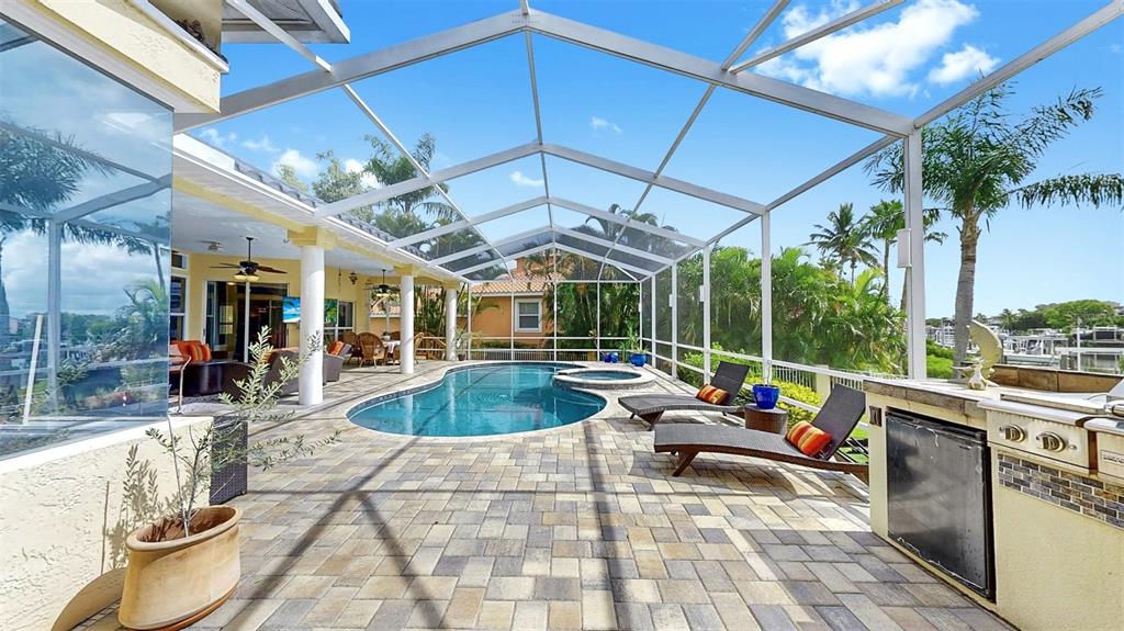 914 Capriccio Lane Apollo Beach, FL 33572 - Photo 56 of 75 a view of a patio with a table and chairs