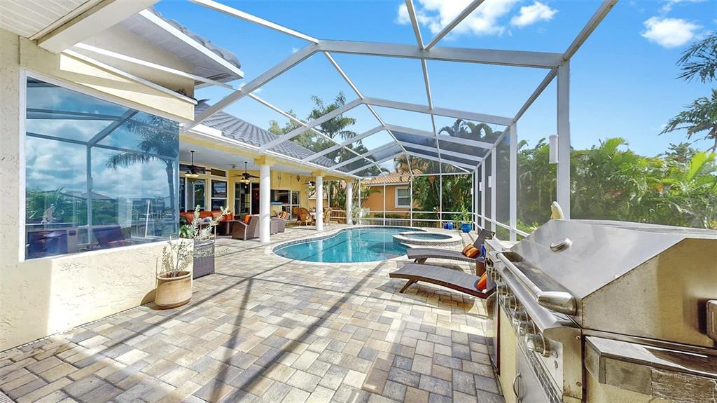 914 Capriccio Lane Apollo Beach, FL 33572 - Photo 59 of 75 a view of a patio with a table and chairs