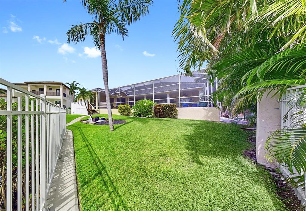 914 Capriccio Lane Apollo Beach, FL 33572 - Photo 66 of 75 a view of a backyard with a garden