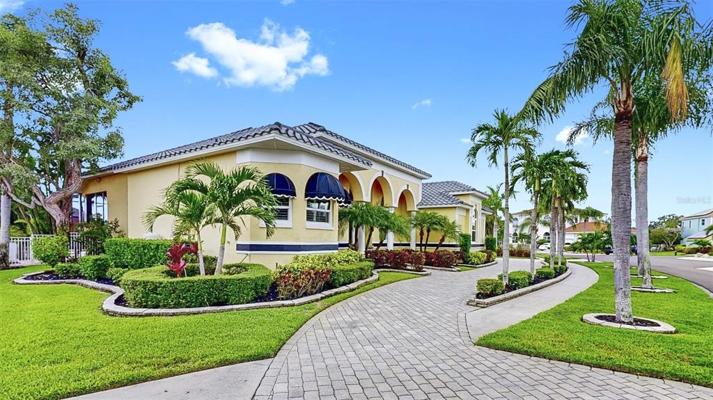 914 Capriccio Lane Apollo Beach, FL 33572 - Photo 74 of 75 a front view of house with yard and green space