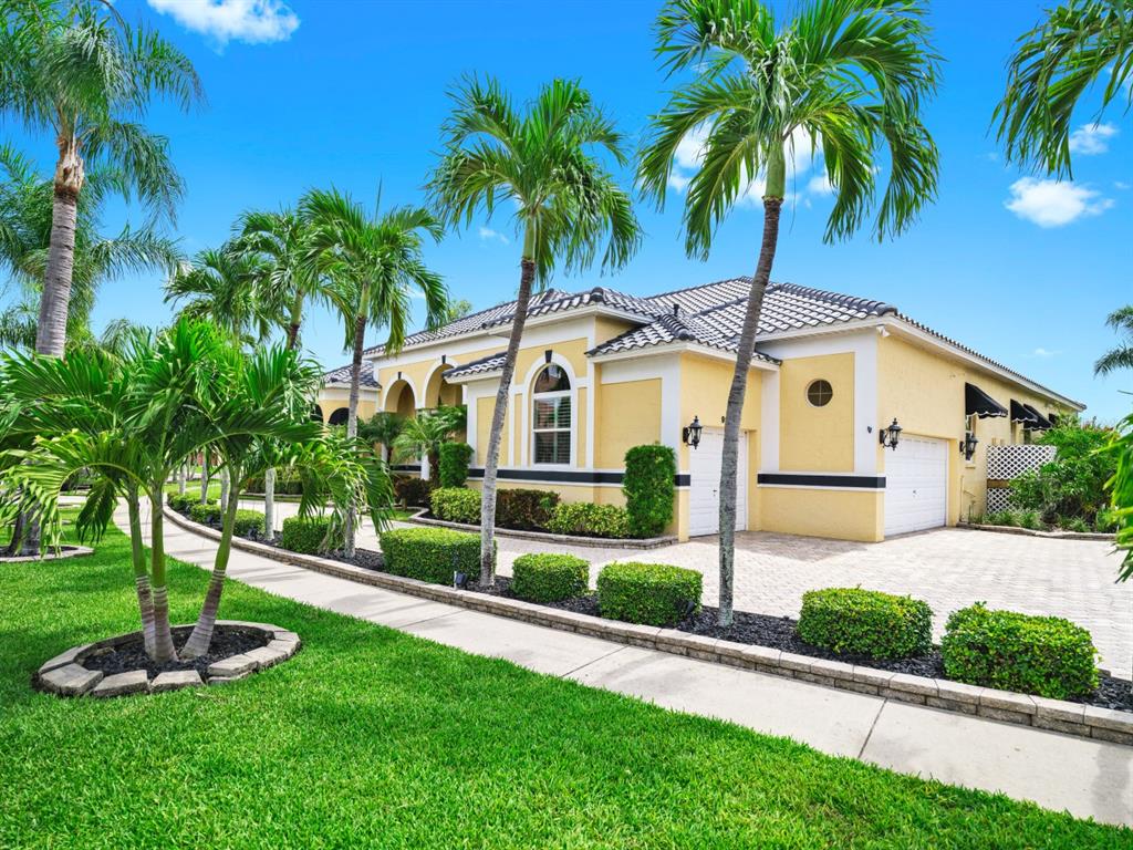 914 Capriccio Lane Apollo Beach, FL 33572 - Photo 8 of 75 a front view of a house with a yard and garage