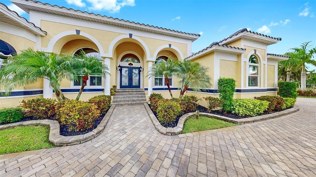 914 Capriccio Lane Apollo Beach, FL 33572 - Photo 9 of 75 a front view of a house with garden