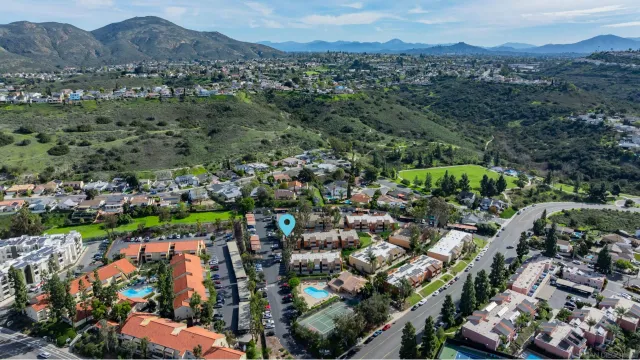an aerial view of residential houses and outdoor space