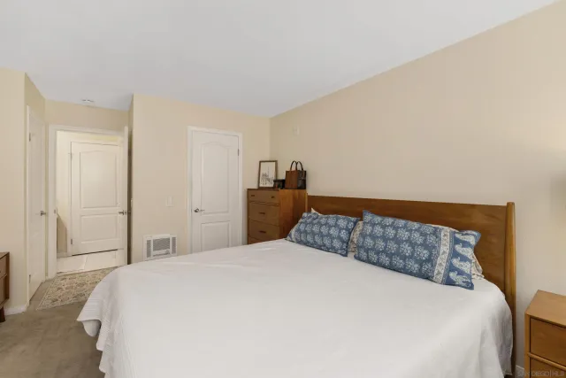 a bedroom with a bed and closet