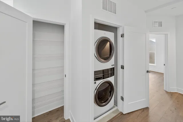 a utility room with sink dryer and washer