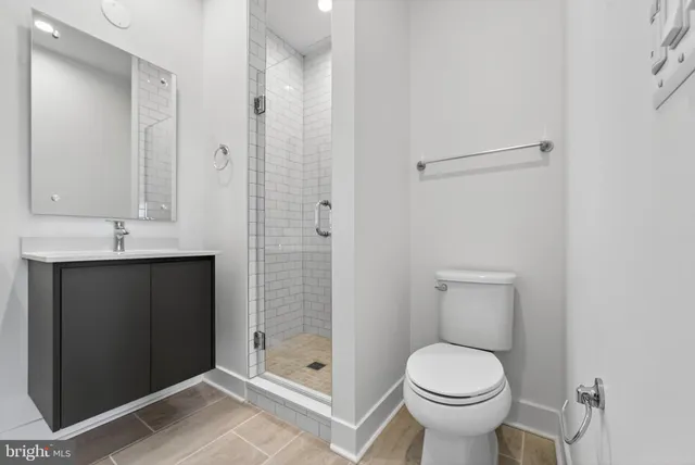 a bathroom with a shower and a toilet