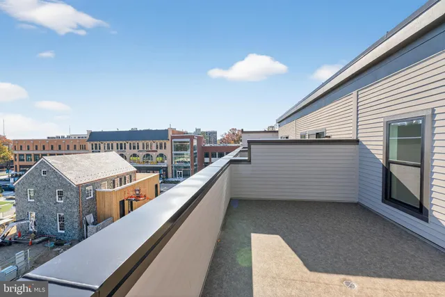 a view of a balcony with an outdoor seating