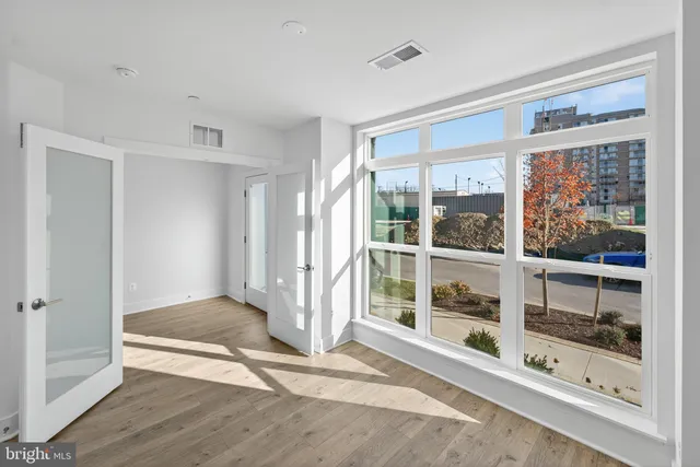 a view of an empty room with a window