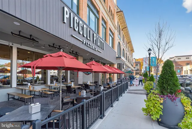 a view of a cafe with sitting area