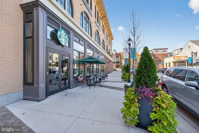 a view of a building with sitting area