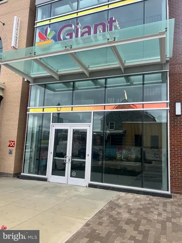 a front view of a building with retail shops