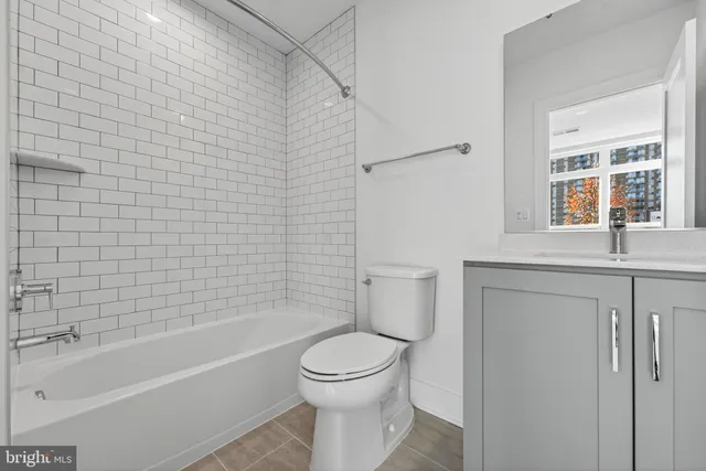 a bathroom with a toilet a sink and bathtub