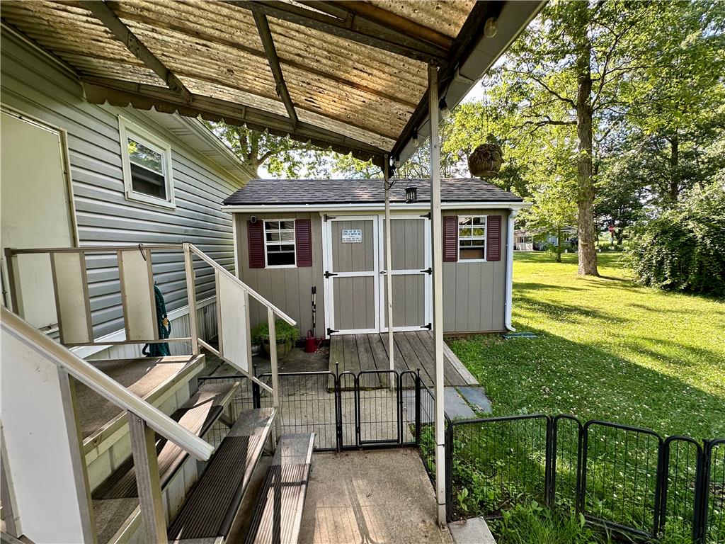 381 Red Oak Lane Bath, PA 18014 - Photo 25 of 27 A well-maintained shed with a quaint window and shutter detail stands ready for all your outdoor storage needs.