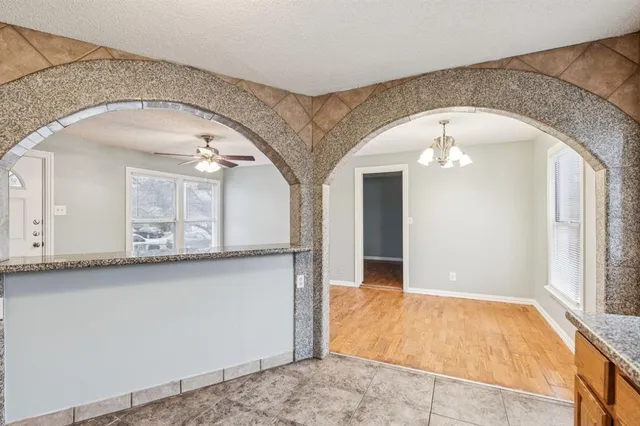 a view of a hallway with granite countertop