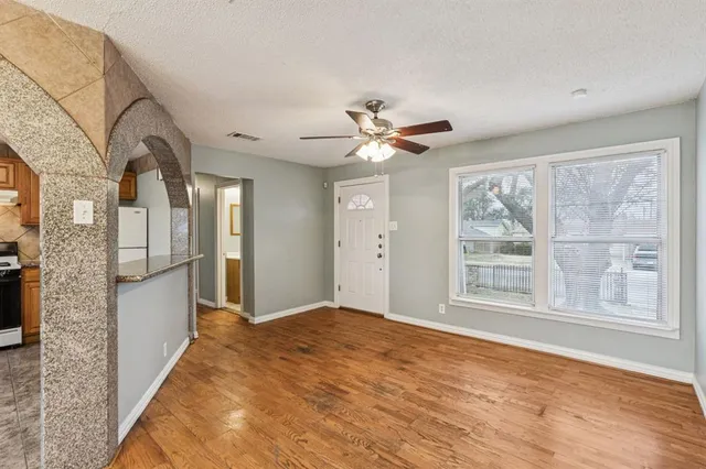 a view of an empty room with a window