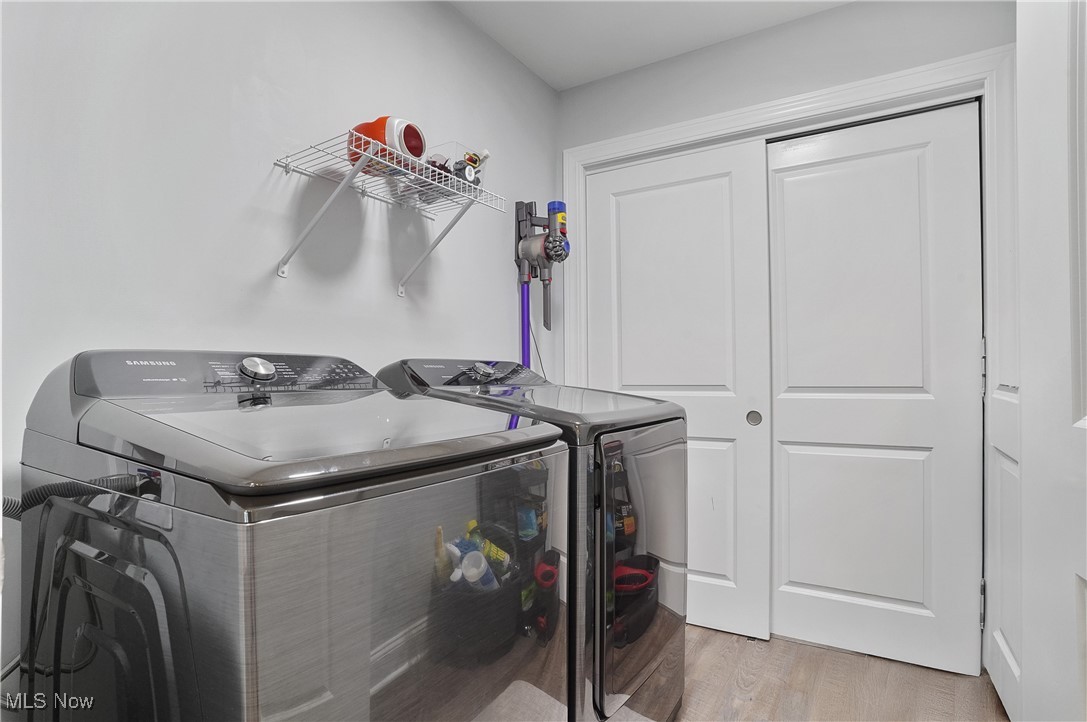 603 South Raccoon Road, Unit 13 Youngstown, OH 44515 - Photo 21 of 27 Laundry room featuring independent washer and dryer and wood finished floors