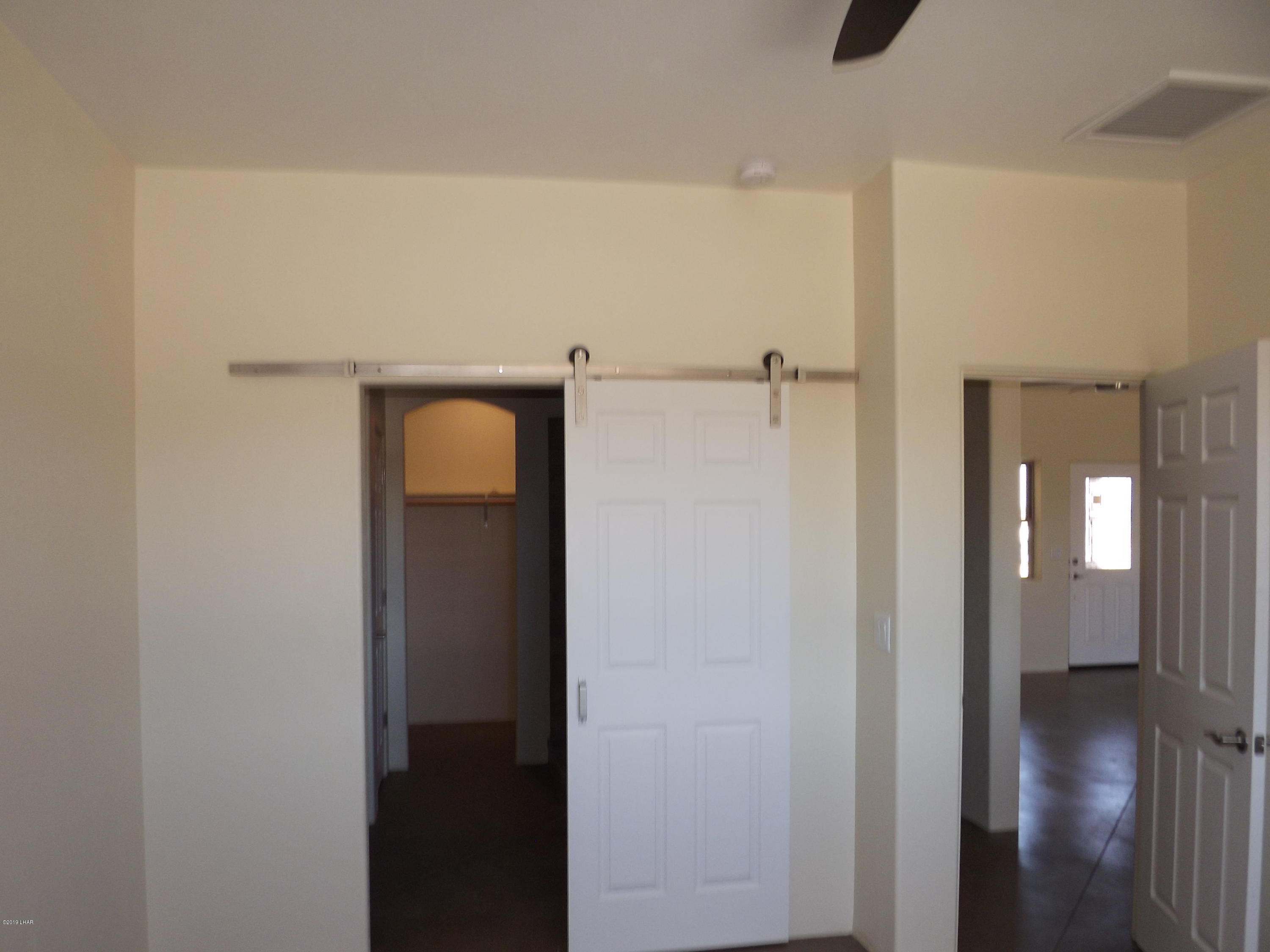 2516 Cielo Road Yucca, AZ 86438 - Photo 18 of 34 Barn door slider in master suite