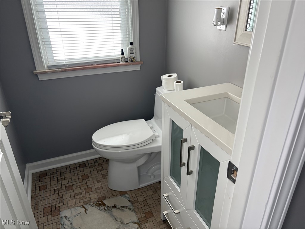 7817 Dalebrook Road Independence, OH 44131 - Photo 10 of 28 Bathroom with tile patterned flooring, sink, and toilet