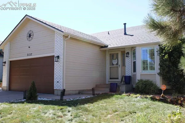 a front view of house with a yard