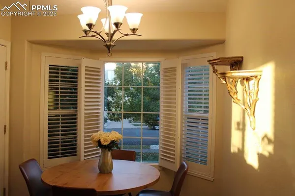 a dining room with furniture and window