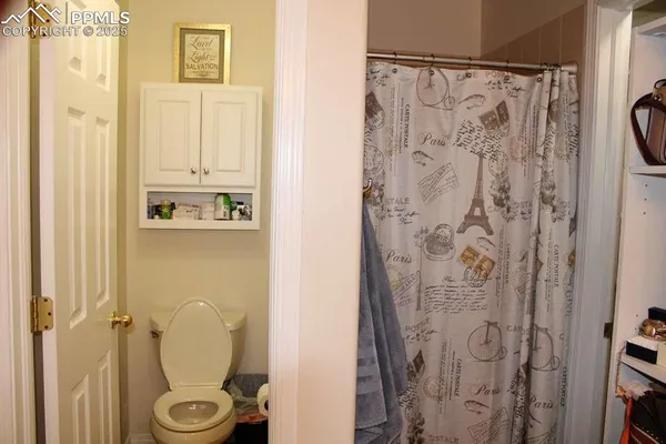 a bathroom with a shower and a sink