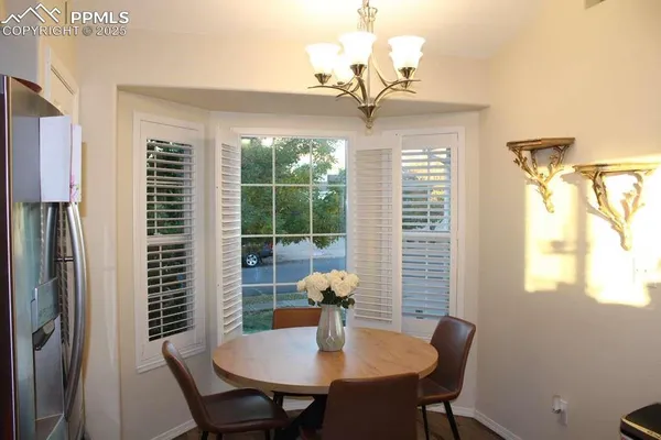 a view of a dining room with furniture window and outside view