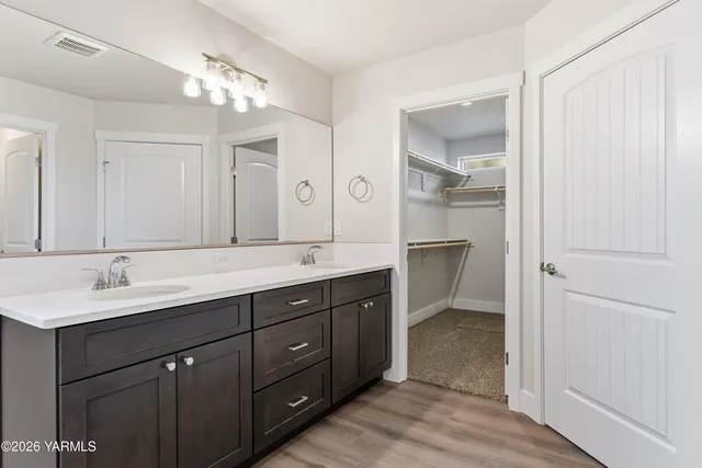 a white toilet sitting next to a bathroom sink