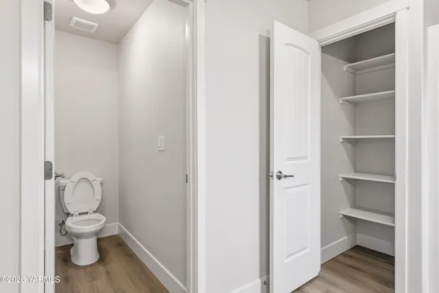 a view of a room with racks on the wall