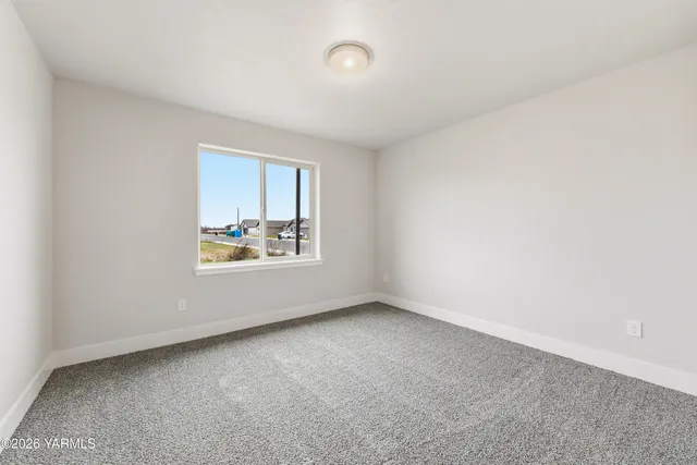 an empty room with closet area