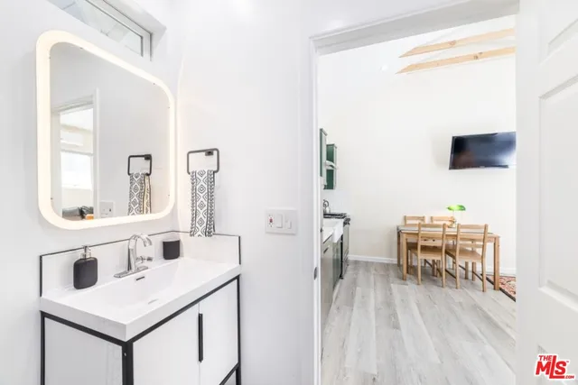 a bathroom with a sink and a mirror