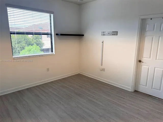 a bathroom with a sink vanity granite shower and a mirror