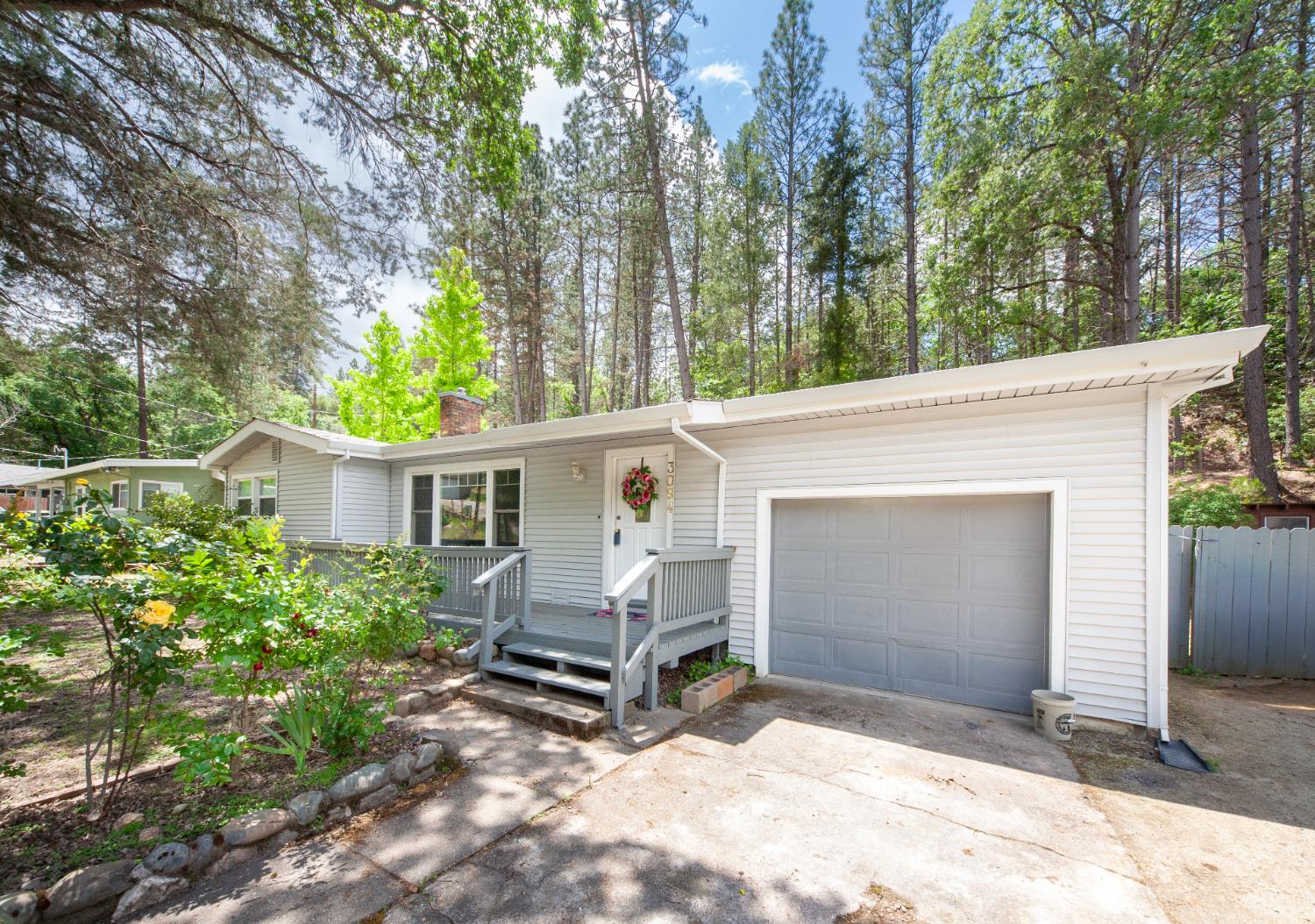 3094 Wiltse Road Placerville, CA 95667 - Photo 1 of 1 a view of backyard with a barn and a large tree
