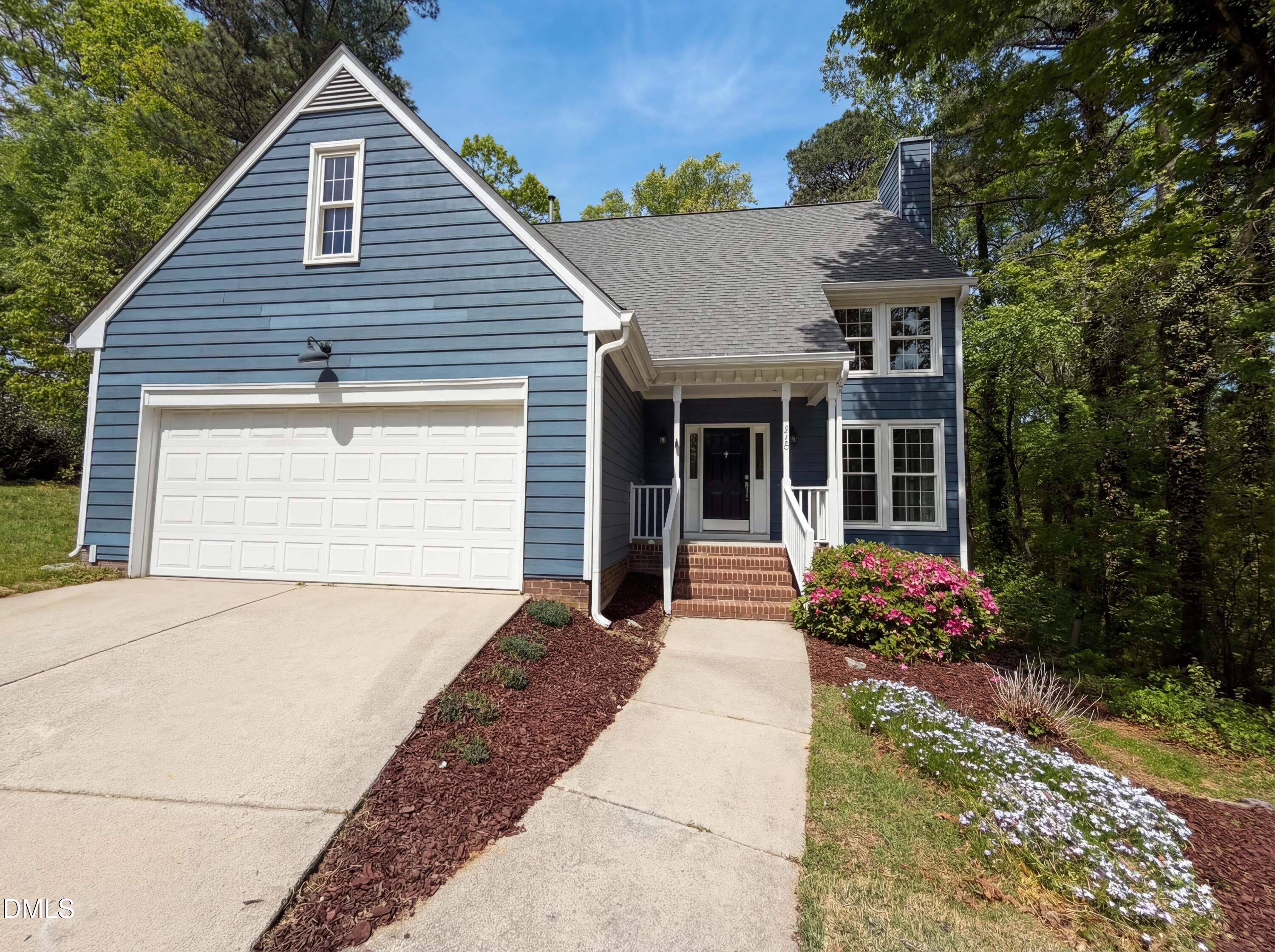 515 Gablefield Lane Apex, NC 27502 - Photo 1 of 20 a front view of a house with a yard and potted plants