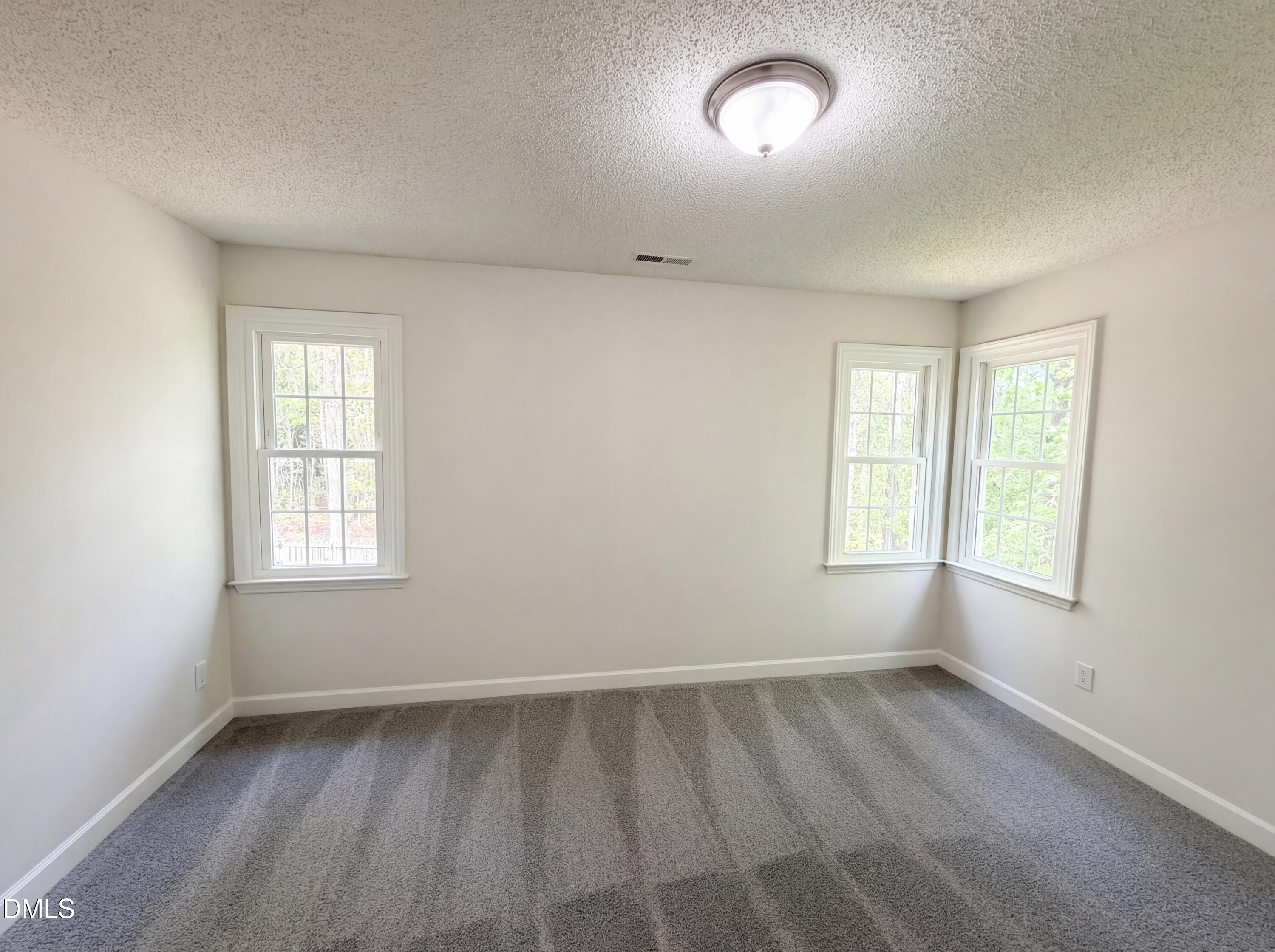 515 Gablefield Lane Apex, NC 27502 - Photo 14 of 20 an empty room with a window