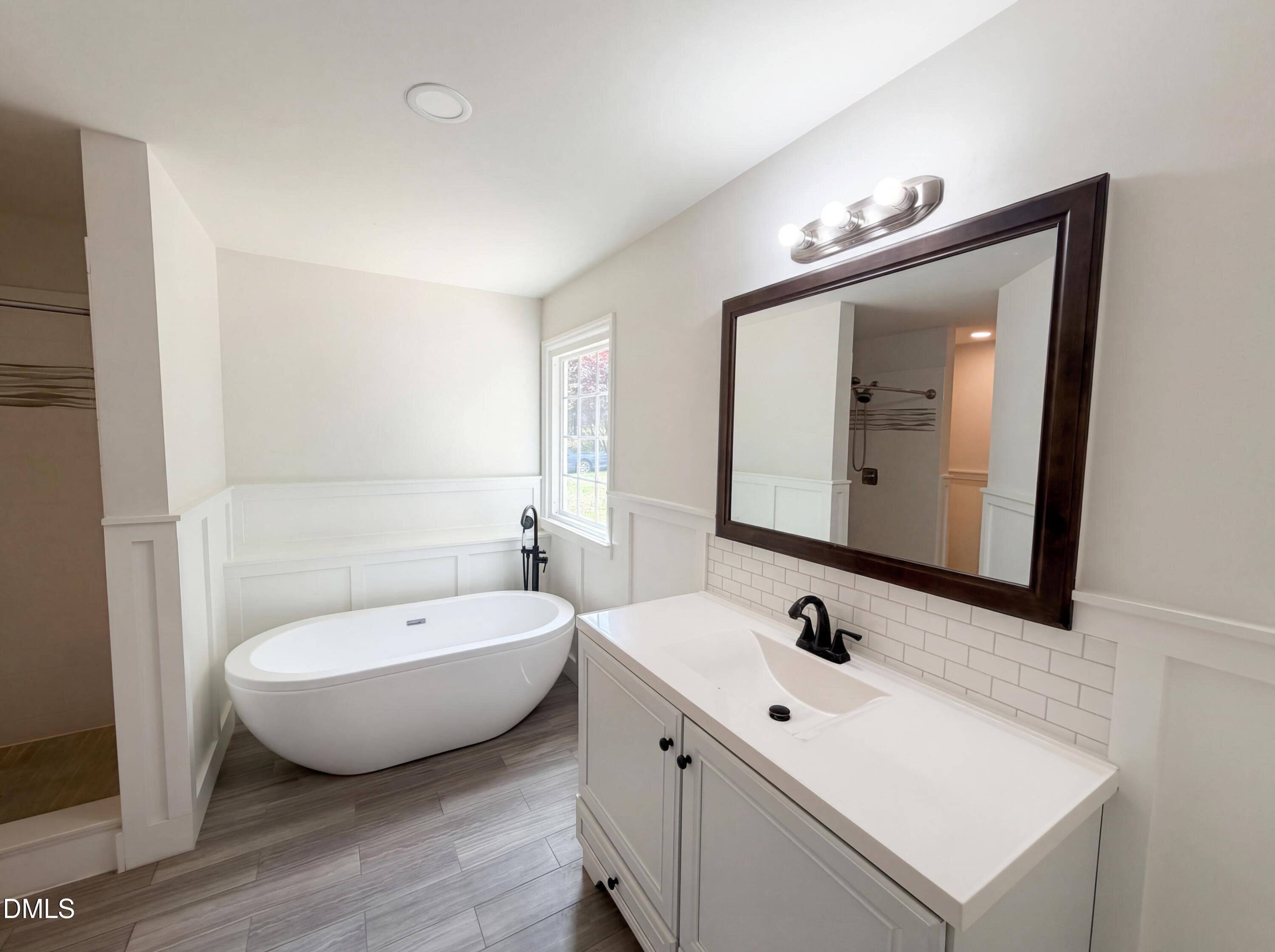 515 Gablefield Lane Apex, NC 27502 - Photo 16 of 20 a bathroom with a double vanity sink and mirror