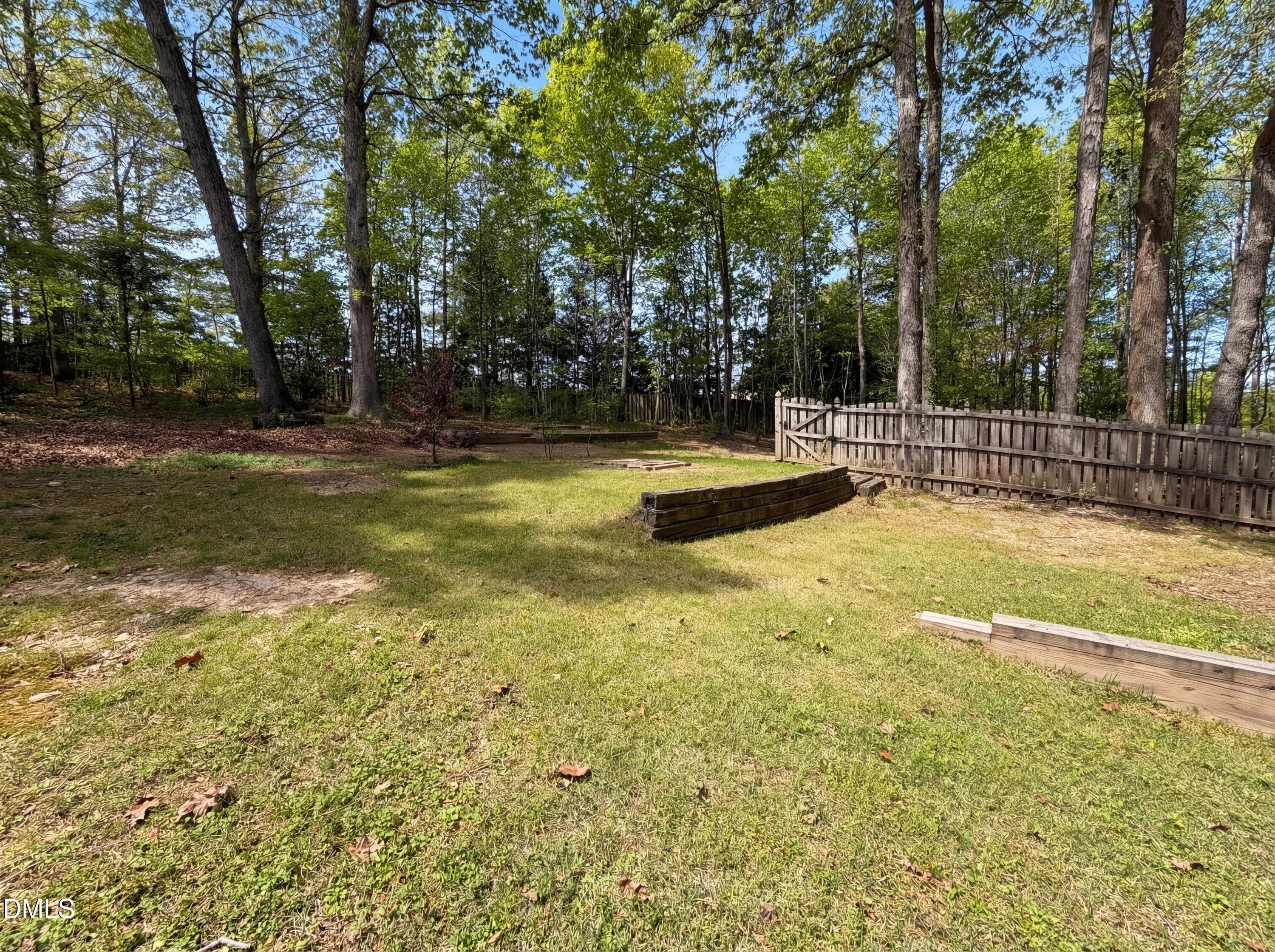 515 Gablefield Lane Apex, NC 27502 - Photo 19 of 20 a view of a swimming pool with a bench