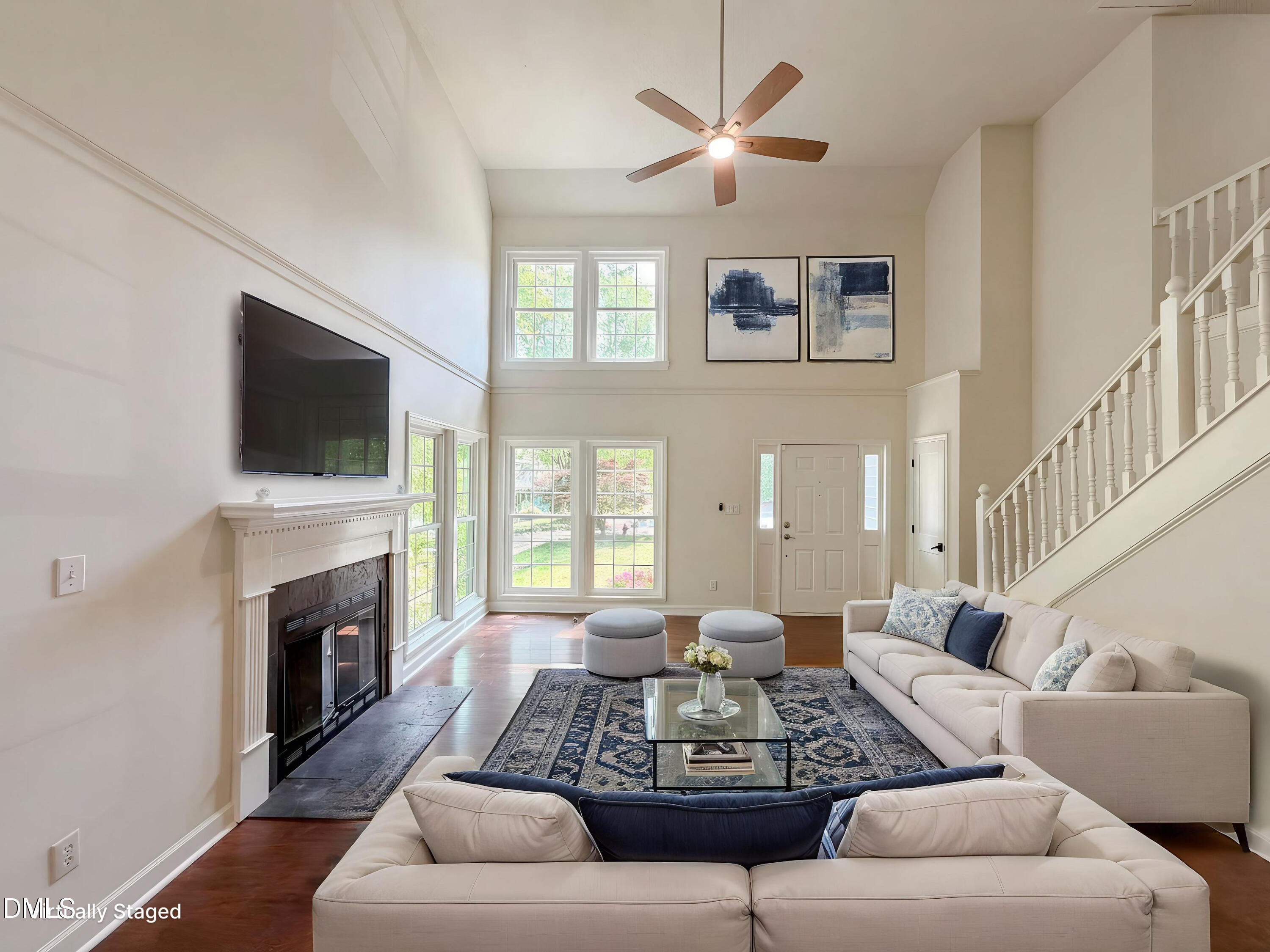 515 Gablefield Lane Apex, NC 27502 - Photo 2 of 20 a living room with furniture fireplace and a flat screen tv