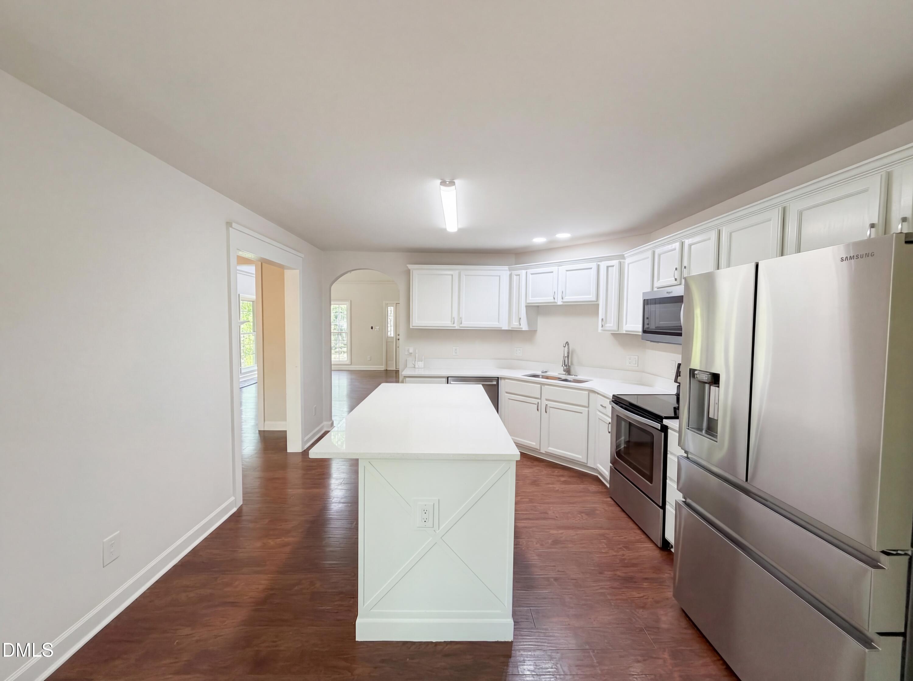 515 Gablefield Lane Apex, NC 27502 - Photo 7 of 20 a kitchen with a refrigerator sink and stove