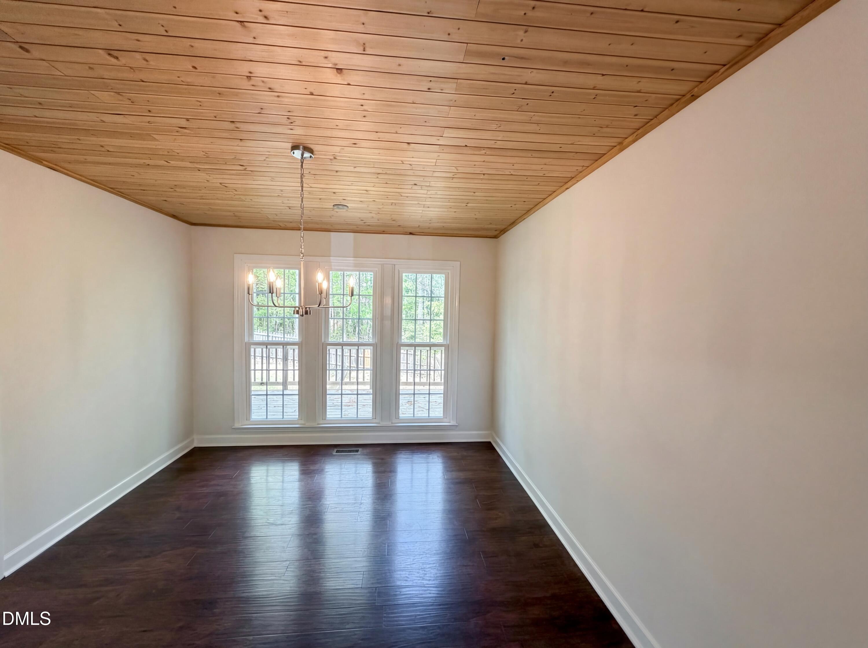 515 Gablefield Lane Apex, NC 27502 - Photo 9 of 20 wooden floor in an empty room with a window
