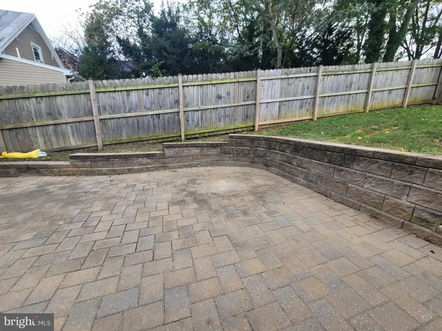 a view of a backyard with a fence