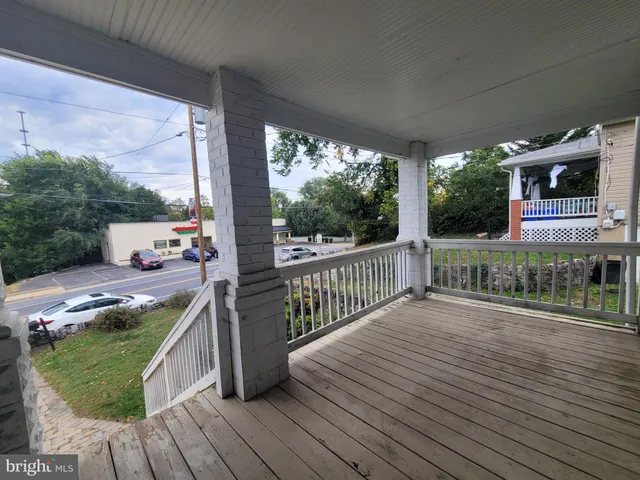 a view of a deck with wooden floor and outer view