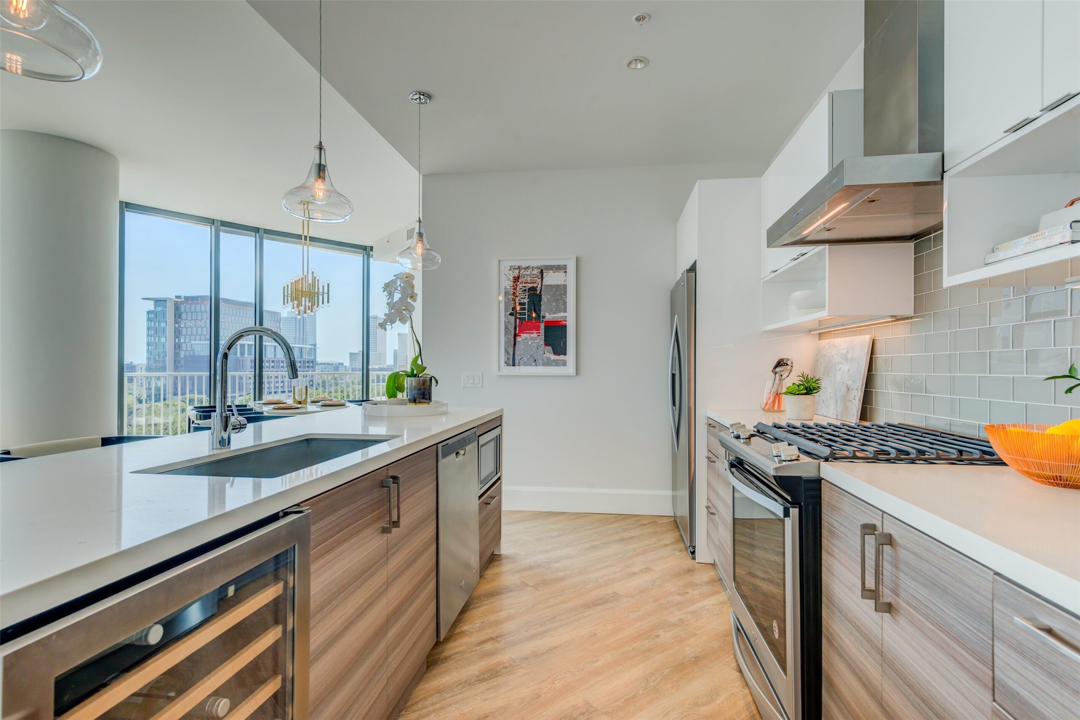 3333 Lake Street, Unit TH5 Houston, TX 77098 - Photo 11 of 50 a kitchen with stainless steel appliances a sink stove and cabinets