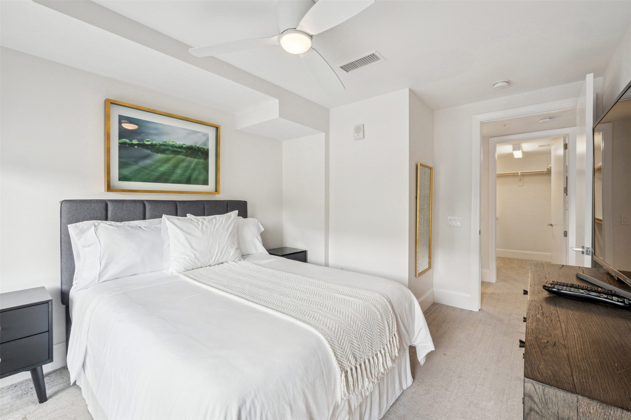 3333 Lake Street, Unit TH5 Houston, TX 77098 - Photo 19 of 50 a bedroom with a bed and a chandelier