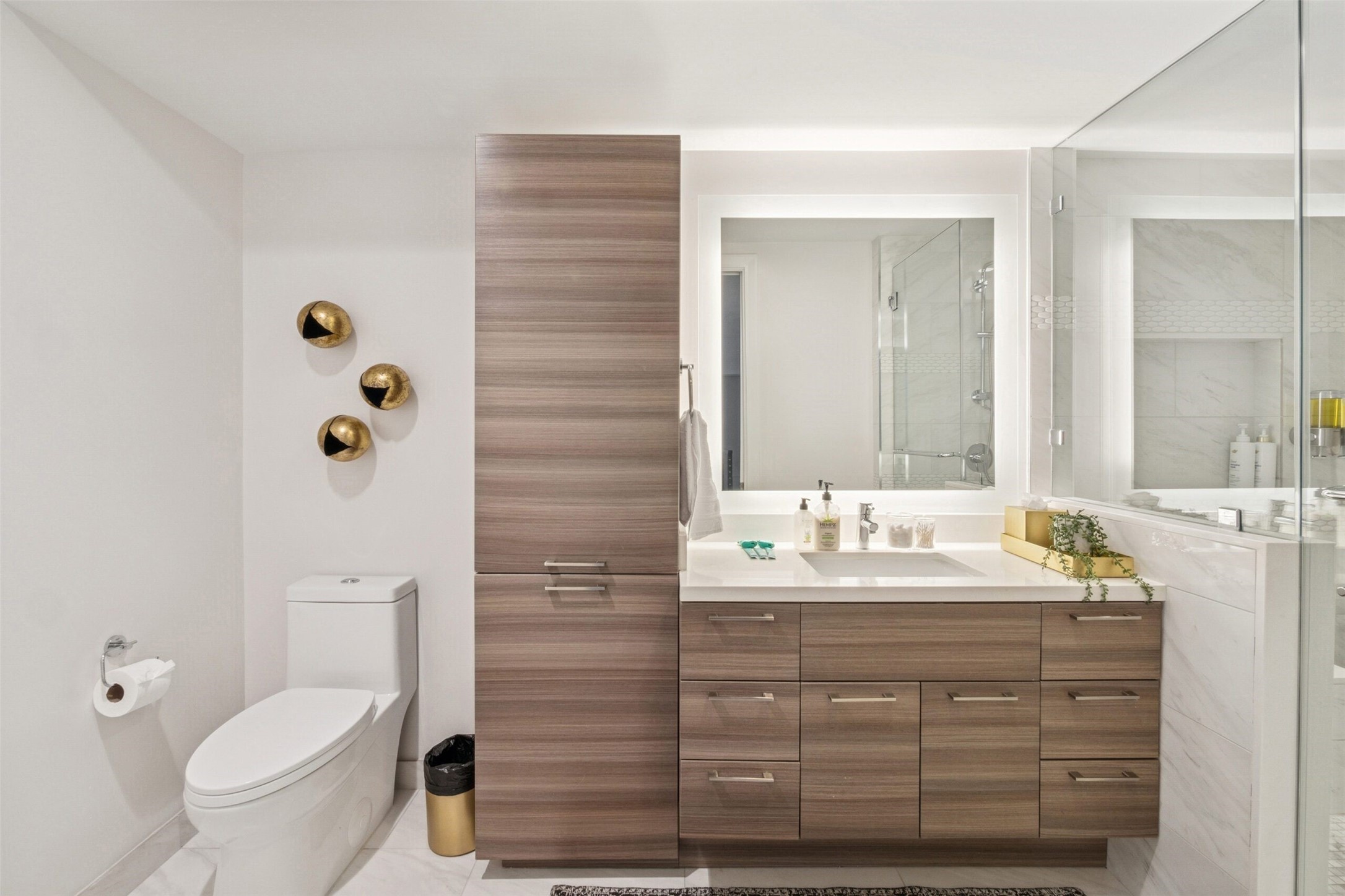 3333 Lake Street, Unit TH5 Houston, TX 77098 - Photo 21 of 50 a bathroom with a double vanity sink toilet and mirror