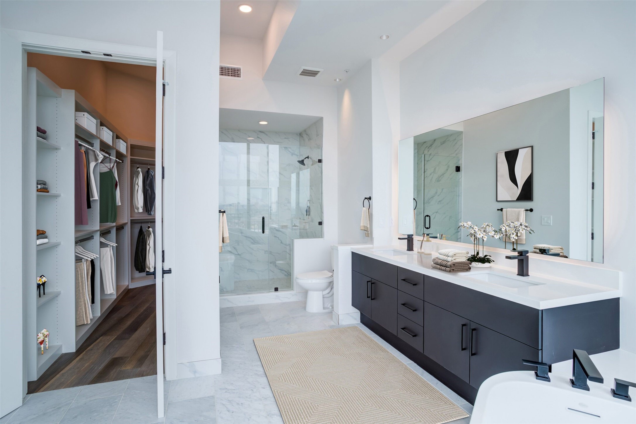 3333 Lake Street, Unit TH5 Houston, TX 77098 - Photo 29 of 50 a spacious bathroom with a double vanity sink mirror double and shower