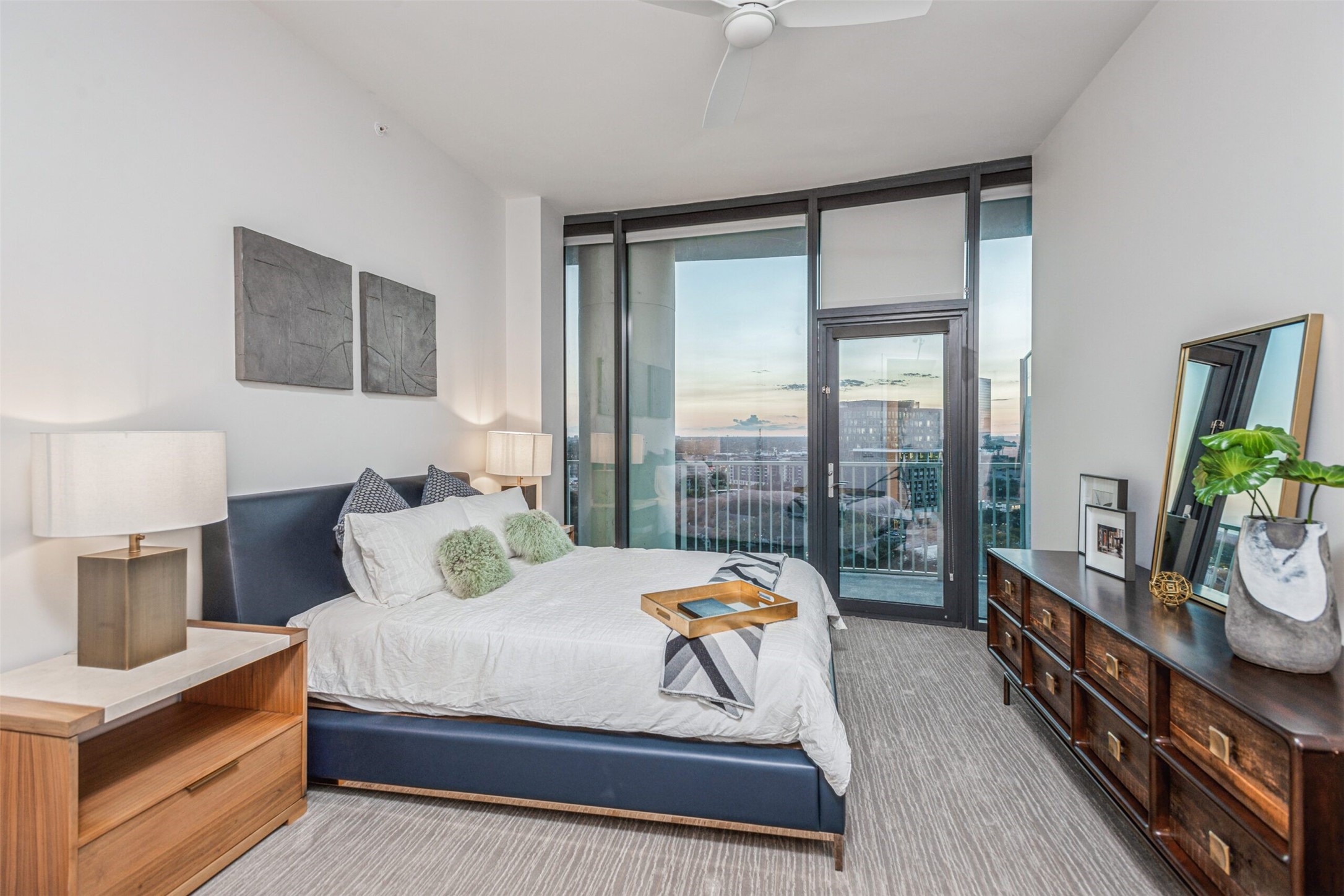 3333 Lake Street, Unit TH5 Houston, TX 77098 - Photo 3 of 50 a bedroom with a bed a flat screen tv and a large window