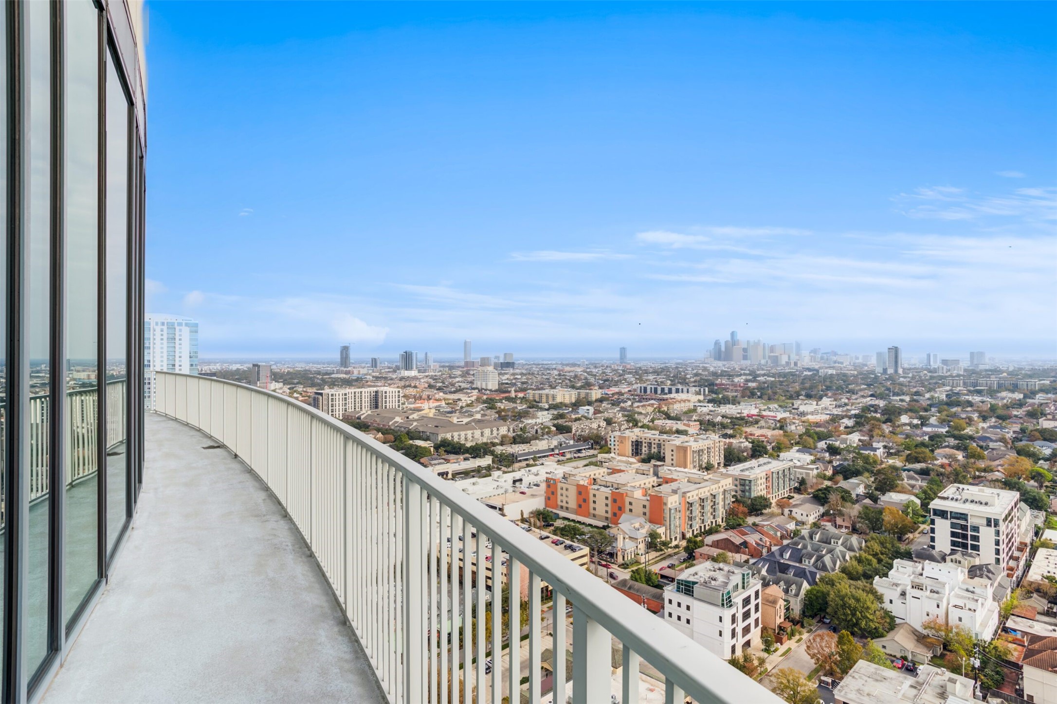 3333 Lake Street, Unit TH5 Houston, TX 77098 - Photo 37 of 50 an view of a city skyline from a balcony