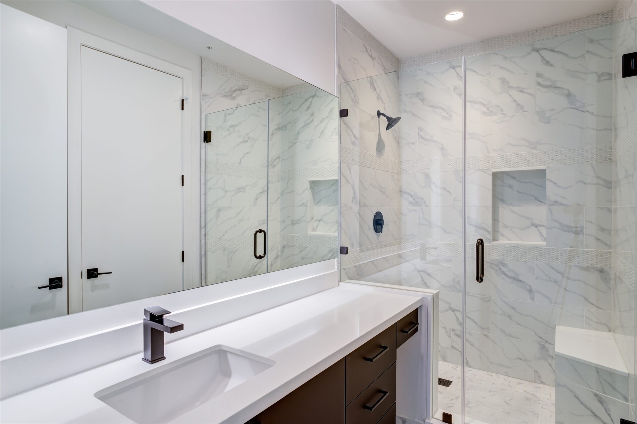 3333 Lake Street, Unit TH5 Houston, TX 77098 - Photo 41 of 50 a bathroom with a sink a granite tub shower and a mirror
